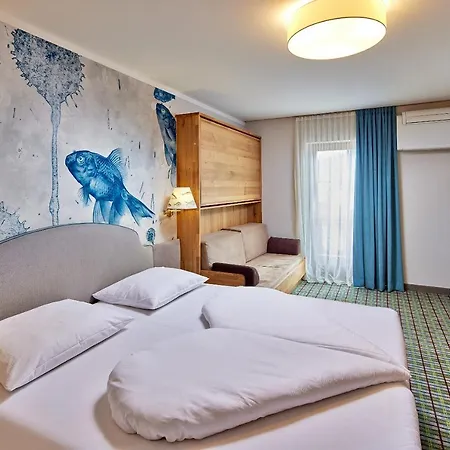 מלון Fish'inn Zell - Fischerwirt 4*